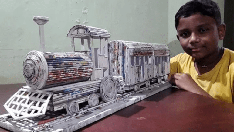Boy creates train model using newspaper and glue viral video