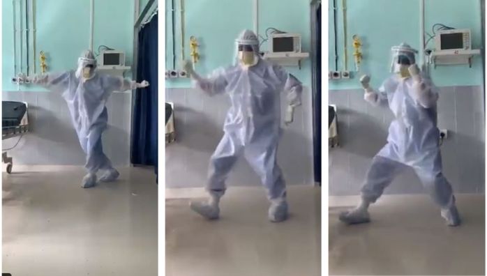 Doctor dancing with PPE kit