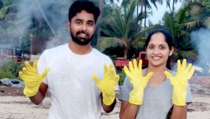 Newly married couple cleans beach