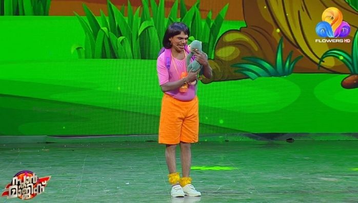 Thankachan Vithura as cartoon character Dora in Star Magic
