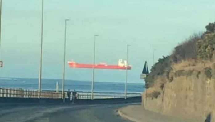 Ship floating across the sky due to optical illusion
